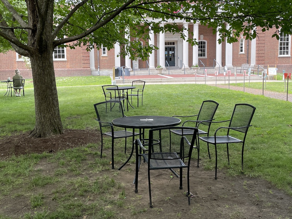 Tables & chairs on library lawn