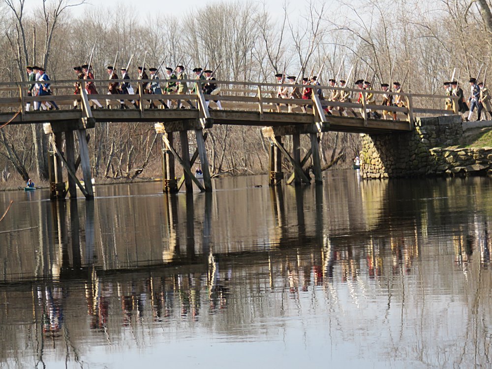Minutemen march over the bridge