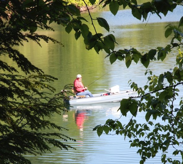 Boater fishing on Walden Pond